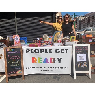 People Get Ready selling books at a New Haven Pride event.